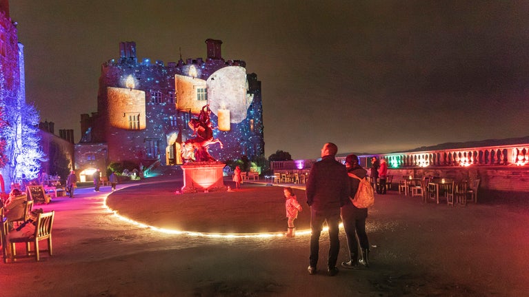 A family enjoying the Christmas illuminations at Powis Castle and Garden